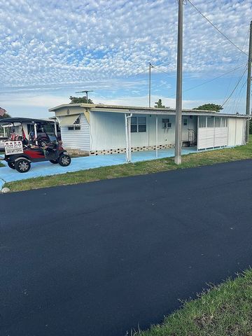 This corner lot home boasts a great view of the lake for your enjoyment. It features a spacious Florida room and includes one bedroom and one bathroom. The home is in move-in condition and comes fully furnished. Features: - Washing Machine - Swimming...