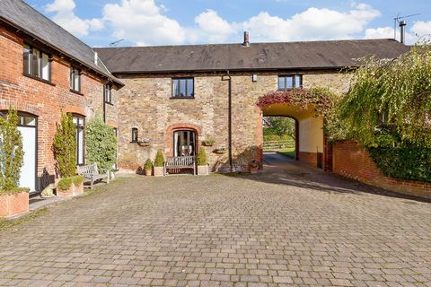 About this property   Converted in the 1990s to a stunning and characterful home this barn conversion is just one of three that surround the courtyard and is accessed through a period style front door that opens into the hallway with a double storage...