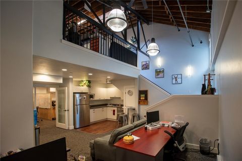 Downtown office space with open floor plan and loft. Includes a large private office, expansive conference room, kitchenette and two ADA baths. Features include high ceilings with exposed beams and attractive finishes throughout. Off 11th Street betw...