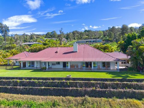 Nestled within a gated community, this expansive 3-acre property offers the perfect balance of privacy and convenience. Located just minutes from the airport, Costco, stunning beaches, and other local amenities, this estate is a rare find.Built in 20...