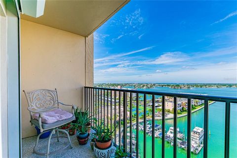 Welcome the New Year in sophistication with this stunning Waterfront Condo! The indescribable allure of this remarkable residence unfolds with expansive water views of Boca Ciega Bay from every room, stretching from Treasure Island to downtown St. Pe...