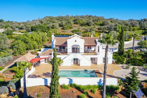 Impressive luxurious well-maintained villa facing south-west to enjoy fabulous sunsets, situated in a peaceful location with stunning views across the countryside which can be seen from every window on both floors and the hills of Monchique mountain ...