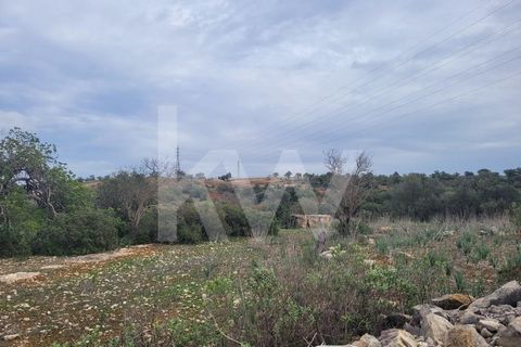Rustic Land with 6080 m2 located in Umbria - Paderne.  km from the centre of Paderne.  12km from the center of Albufeira and 4km from Ferreiras.  Flat terrain.  Composed of several arable trees, carob trees and bush.  Good for cultivation. It borders...