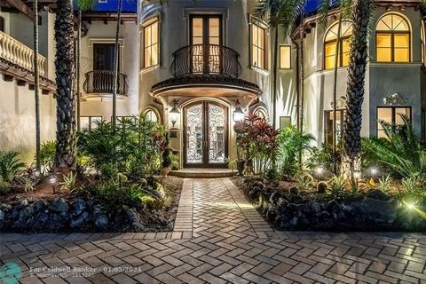 Las Olas, Stunning waterfront estate with great water views from everywhere, boater's paradise with 100' of deep water dockage, wide canal for mega-yachts, on prestigious Nurmi Isle. Great floor plan, High ceilings, Large Livingroom with a grand fire...