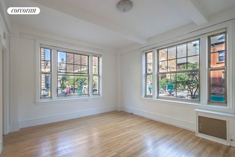 Price Improvement! Beautiful, sun-drenched one-bedroom corner apartment in a doorman building on a prime Upper West Side block. This dramatic space has huge windows with commanding views of Amsterdam Avenue, 74th Street, and beyond. High beamed ceili...