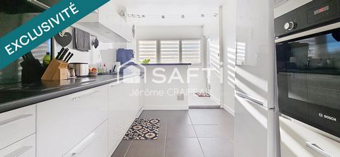 Appartement rénové avec 3 chambres, garage, cave et parking en centre-ville.
