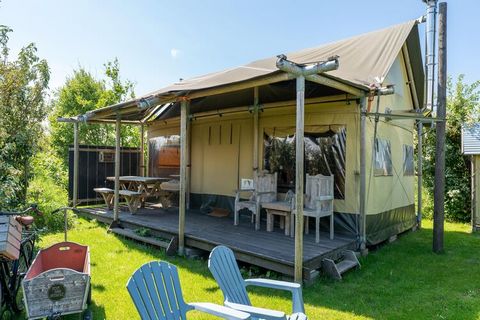 Spend your vacation in a serene tent lodge in Callantsoog. It has 3 bedrooms and offers a comfortable stay for a group of 6 people or families with children and comes with a terrace, garden, and wood stove. The beautiful surroundings are perfect for ...