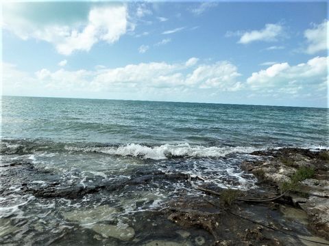 Waterfront lot in Simm's with rocky shoreline. Quick access to great fishing grounds this lot offers beautiful sunsets in the tropical evenings. The lot has a dilapidated house which needs to be removed. Doctor's Creek boat ramp is close by for launc...