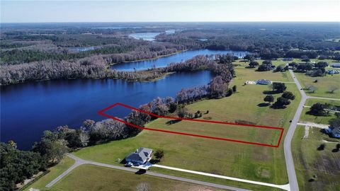 Central Florida Lakefront living at it's best. Come build your dream home in picturesque Pretty Lake Ranch, a gated community located on the western shores of the Pretty Lake chain of lakes. This lot totals 3.4 acres (1.6+/- dry) with approximately 1...