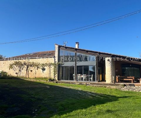 LOVE AT FIRST SIGHT GUARANTEED FOR THIS BEAUTIFUL PROPERTY enthroned on 1 hectare of land, comprising: - A Charente house on 2 levels, totalling 215 m² of living space composed on the ground floor of a living / dining room, an independent A/E kitchen...