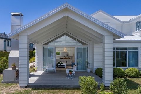 Experience the serenity of understated quality in this contemporary and elegant masterpiece that defines modern luxury. Adorned in weatherboard in a palette of white on white, this home exudes calm and beauty at every turn. As you enter, herringbone ...