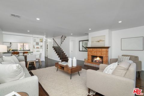 Welcome to this beautifully designed 2-story townhome nestled in the heart of Mar Vista. Featuring expansive, open spaces and an abundance of natural light. The kitchen, partially equipped with stainless steel appliances and ample workspaces, flows s...