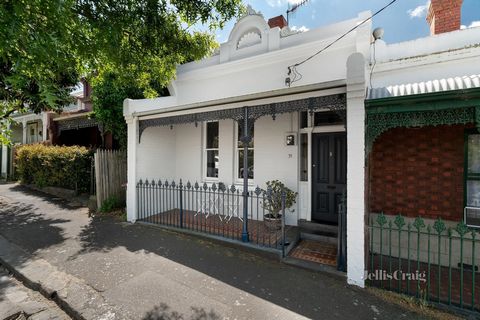 Exuding the charm and elegance synonymous with its boom era origins, this semi detached gem fuses leafy serenity with lifestyle amenity in a coveted central Richmond enclave. Its wrought iron fence and lacework precursors of intricacies to come, orna...