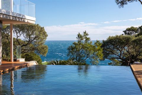 Summary Superb newly-built contemporary style villa located at the end of the Cap, near the Grand Hotel and surrounded by parasol pine trees. It is equipped with all of the latest technologies and luxuriously appointed throughout. The glass facades b...