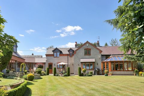 November Cottage enjoys an idyllic, semi-rural setting and stunning views over rolling countryside. Ideally located within easy walking distance of the village on a quiet back water, this substantial six bedroom home stands in 0.26 acres of matures g...