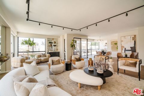 Welcome to this beautifully renovated corner residence in prime Beverly Hills, offering a unique blend of elegance and sophistication. As you step onto the hardwood floors of this immaculate and spacious 2-bedroom, 2.5-bathroom home, you're greeted b...