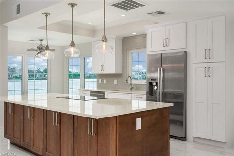 FULLY RENOVATED - BRIGHT AND AIRY!!!! Brand new, One-Of-A-Kind, Open Concept, Water on 2 sides, plus Pool View! This is a one-story unit, making tropical living easy and breezy. Imagine living directly above Doctor's Bay in the most iconic condo buil...