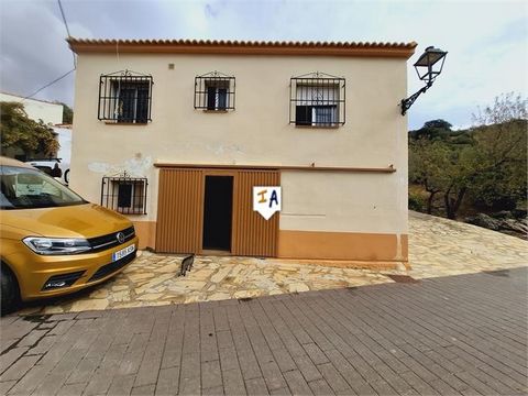 PRICED TO SELL! Discover this 2 bedroom townhouse on the outskirts of Alcaucín in the province of Málaga in Andalucia, Spain, offering unique potential for comfortable living or investment. Divided into two distinct sections, one part features a spac...