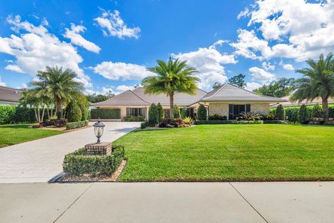 Breakers West estate home on over a half acre invokes classic timeless beauty in true Palm Beach style architecture. Newly renovated with nothing spared in 2022. Gourmet chef's kitchen with Cambria quartz countertops, gas range GE Monogram appliances...