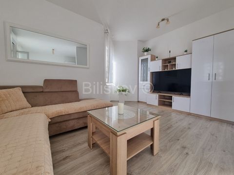 Kaštel Štafilić, fully renovated and newly furnished two-bedroom apartment, measuring 70.50 m², located on the first floor of a residential building with a newly renovated facade (completed approximately 2 years ago). The apartment consists of a spac...