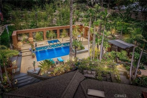 Welcome to this one-of-a-kind mid-century modern estate, tucked behind private gates in the prestigious hills of Cowan Heights. Set on nearly an acre, this single-level 4-bedroom, 3.5-bath residence is the lowest-priced home in Cowan Heights, offerin...