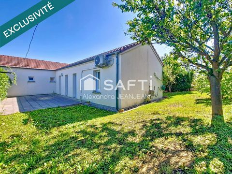 Maison de plain pied avec garage et jardin