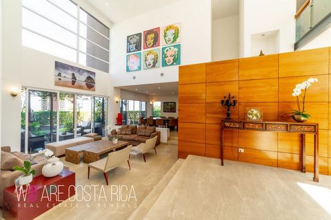 This luxury contemporary house is located in an exclusive community with 24/7 security and enticing amenities. The house itself has a multi-level distribution with triple-height ceilings and natural light, providing an open and integrated atmosphere....