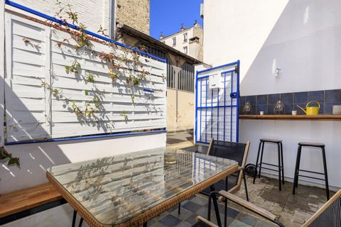 For sale, a house of 125 square meters with a 10 square meter terrace. Near the Canal Saint Martin, in a quiet and secured private lane, charming house including on the first floor a nice living room (living room, dining room, open kitchen fully equi...
