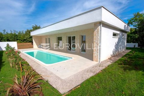 In an extremely quiet location, surrounded by greenery and forest, this beautiful detached single-storey villa is located. It has an area of 171.29 m2 and consists of: entrance hall, living room with kitchen and dining room, three bedrooms, the maste...