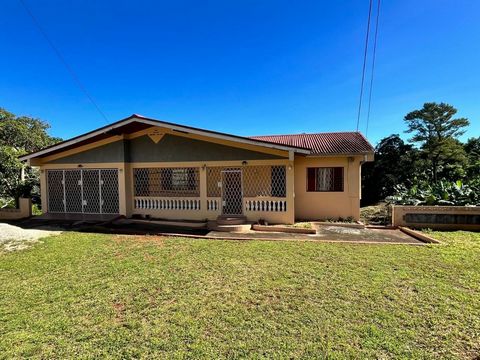 In Cedar Gardens, Mandeville, lies this investment property on approx 1 acre with bearing fruit trees including ackee, avocado, tangerine, coconut, papaya and banana. !! The main floor of the residence has 4 beds, 2 baths including a lovely master en...