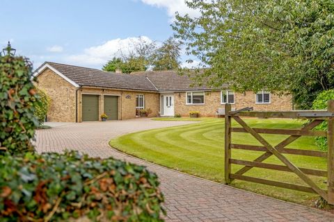 Located in the quiet village of Honington, Stone Acre is a well-presented bungalow with stunning countryside views, delightful gardens and a paddock. Set in around 1.6 acres, the grounds include a large stone stable block with outbuildings for equest...