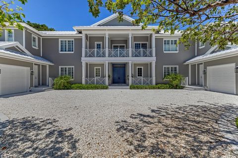 On over a half-acre, this stately custom-built estate in exclusive Point Manalapan offers a spacious floor plan, with spacious rooms that open to the loggia, covered lanais and balcony viewing the expansive backyard entertaining area centered on a la...