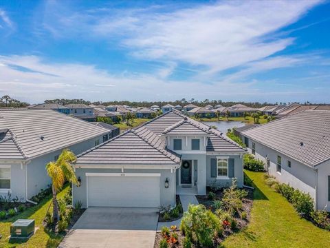 Why wait for new construction when you can experience the allure of this like-new 2023 White Star plan, nestled in the sought-after gated Neal Community of Grand Park. Enjoy maintenance-free living with lawn care included in the quarterly HOA fees an...