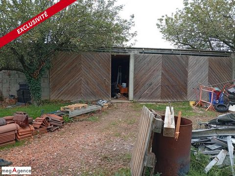 Terrain à Bâtir avec garage/atelier.