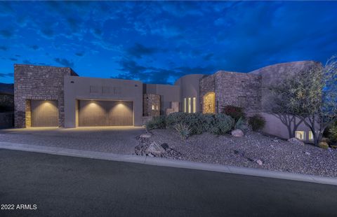 VIEWS! VIEWS! VIEWS! Fountain Hills at its best! This 6706 square feet custom-built home has it all--a sports court, infinity pool & spa, built in BBQ, fire pits, a 1200 square foot built-in seating rooftop deck with panoramic views of the many mount...
