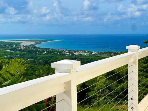 Spectacular sea views over Frederiksted, Sandy Point, and the South Shore from this great home in the gated Jolly Hills neighborhood. This home was constructed just five years ago with a nice deck walkway that goes all the way around it. Two bedrooms...