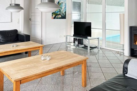 Holiday cottage with swimming pool, whirlpool and sauna located on 3500 m² natural plot in the peaceful and scenic area Husby approx. 10 min drive from the resort of Søndervig. The house is built of bricks and has thatched roof. The house is well fur...