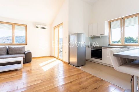 Two bedroom apartment with a usable area of 63.02 m2 on the second floor of a newer building, close to the sea. The apartment consists of a kitchen, dining room, living room, terrace, hallway, bathroom, two bedrooms and a parking space. It is sold fu...