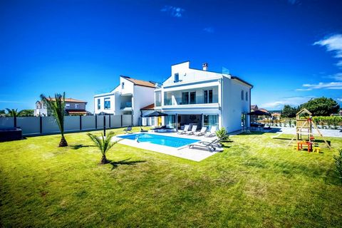 Farkaš luxury real estate sells a beautiful modern villa 5 km from the center of Poreč in a quiet location.The villa has an area of ​​199 m² and consists of two floors with: kitchen with dining room and living room with fireplace, 6 bedrooms, 4 bathr...