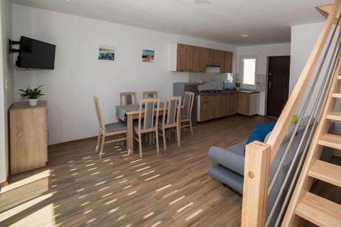 Family holiday resort with swimming pool, in a quiet area, next to a large water park. 10 minutes walk to the seaside beach. Comfortable, two-story holiday home is suitable for comfortable relaxation of 7 people. On the ground floor there is a spacio...