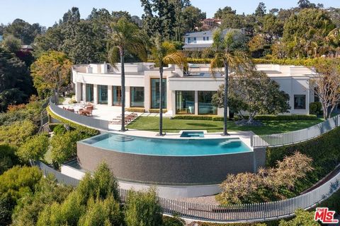 Museum Modern on an exceptional Beverly Hills Promontory. Panoramic views from Ocean to Downtown. No roof tops or obstructions. Exceptional scale with soaring ceilings. Walls of glass frame the jetliner views. Over 7,500sqft. Primary suite is on par ...