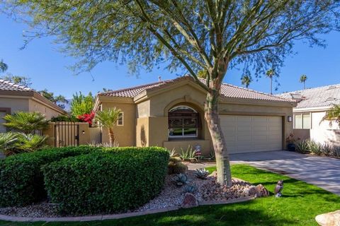 Stunning mountain views highlight this west-facing St. Andrews plan in the guard-gated Desert Princess community, offering privacy and superior views. Fully remodeled with luxury materials, this home is a Desert Oasis. A beautifully landscaped front ...