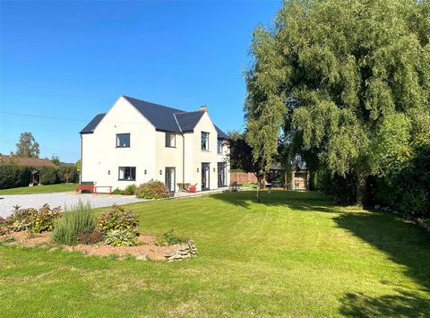 An impressive and beautifully presented executive detached house located at the foot of the lovely Holford Combe in this desirable Quantock Hills village with renovated and extended 4 bedroom en-suite accommodation to include an attached annexe and s...