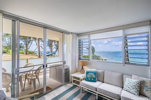 Discover the ultimate beachfront living with this rare 2-bedroom condo in beautiful Punaluu, one of only two in the building and priced at half the cost of other similar Oahu beachfront properties. Completely renovated from the studs, this move-in-re...