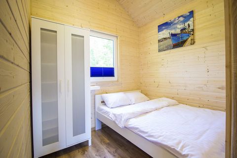 Holiday homes, ideal for a rest, located in Darłówko, only 350 m from the sea. Each cottage is designed for 4 persons. It has a cozy living room, equipped kitchenette, bathroom and two bedrooms (bedroom with double bed, bedroom with bunk bed), terrac...