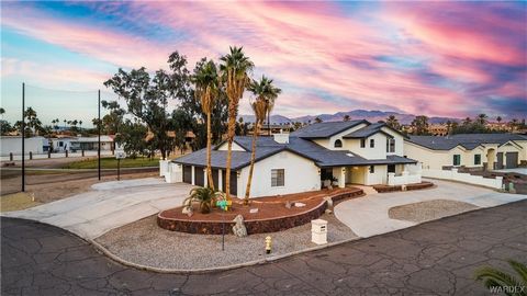 Introducing a spectacular property for sale located on the 3rd fairway of the west course in one of the most exclusive areas of Lake Havasu! Situated in a cul de sac, this stunning home offers 2642 sq ft of living space, over 1300 sq ft of garage spa...