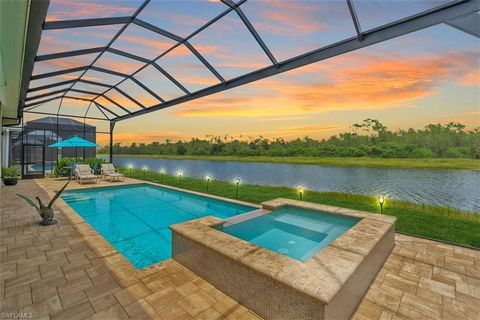 Experience pure elegance in this custom-built luxurious lakefront estate w unchanging preserve views in Naples Reserve. Impressive features of this 4 bed+den, 4.5 bath residence abounds, from the 16' tall ceilings w custom woodwork, high-end designer...