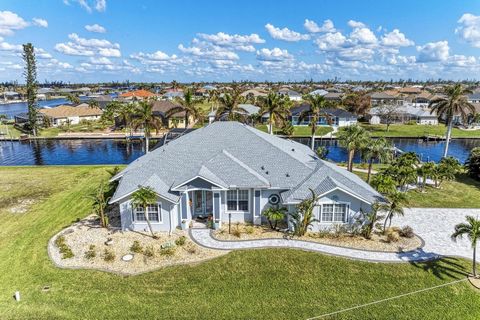 Nestled on a spacious double lot, this stunning waterfront home boasts 184 feet of prime waterfront on a 21,520 foot double lot. Showcasing an abundance of tropical landscaping and stylish curb appeal this home welcomes you to step inside and marvel ...