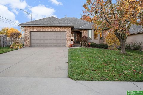 This inviting ranch townhouse offers a cozy family room with vaulted ceilings, a gas fireplace, and brand-new LVT flooring throughout the main floor. The space flows seamlessly into the dining room and opens to an outdoor deck, ideal for relaxing or ...