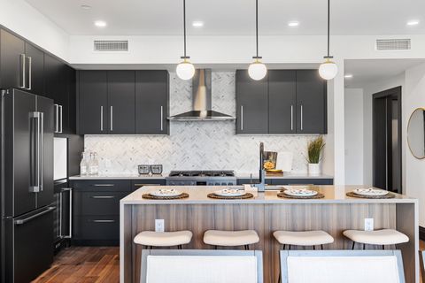 Light and bright, this North facing unit in The Henry, a six-story luxury condominium building in Downtown Bozeman, #104 has a bright and airy feel to it. This town home style unit sits on 2,394 +- SF with two bedrooms, plus den, two and a half bathr...